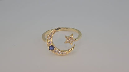 Dainty Crescent moon and star w/ blue stone. Item# Q485 $18.00