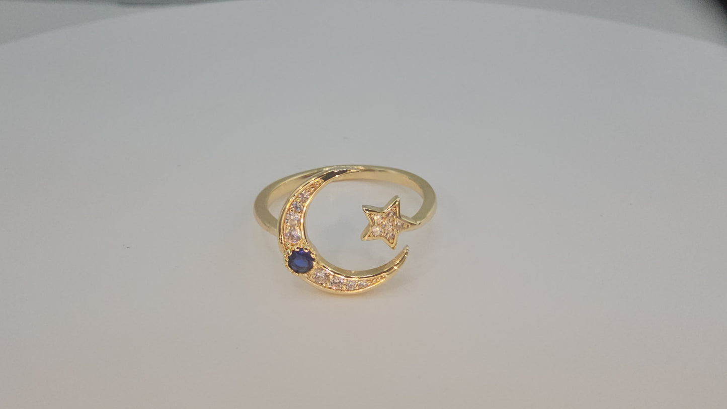 Dainty Crescent moon and star w/ blue stone. Item# Q485 $18.00
