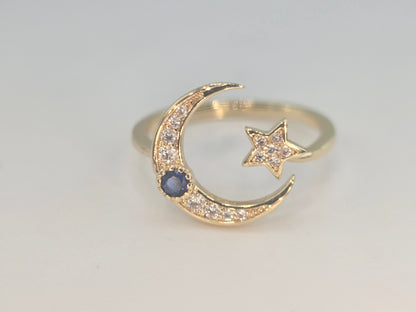 Dainty Crescent moon and star w/ blue stone. Item# Q485 $18.00