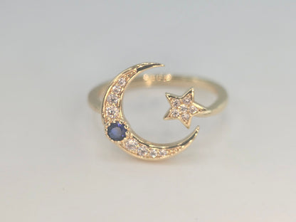 Dainty Crescent moon and star w/ blue stone. Item# Q485 $18.00