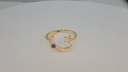 Dainty Crescent moon and star w/ blue stone. Item# Q485 $18.00